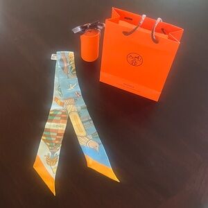 Hermès Les Folies Du Ciel Silk Twilly Scarf.Authentic! New
With Box & Gift Bag